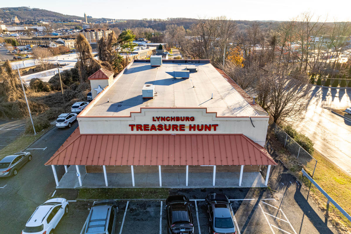 Aerial view of Lynchburg Treasure Hunt building with parking lot and surrounding landscape